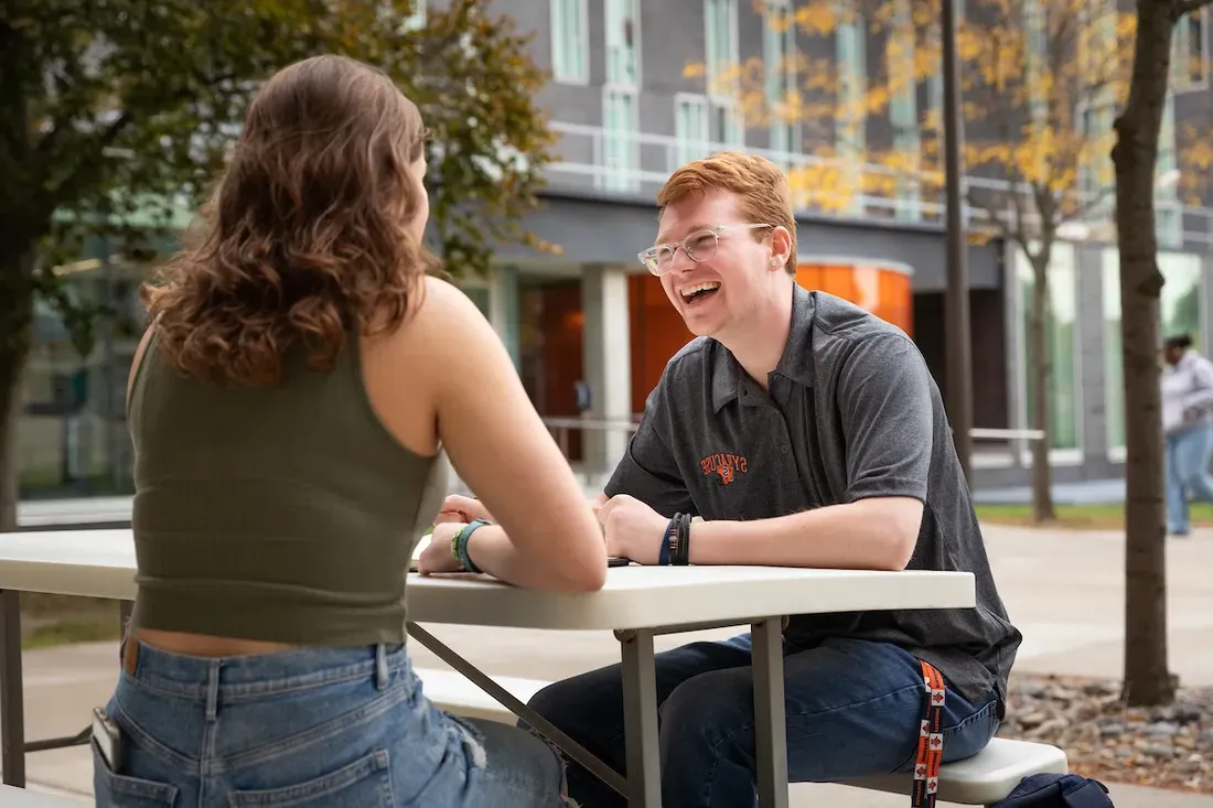 Two people sitting together.